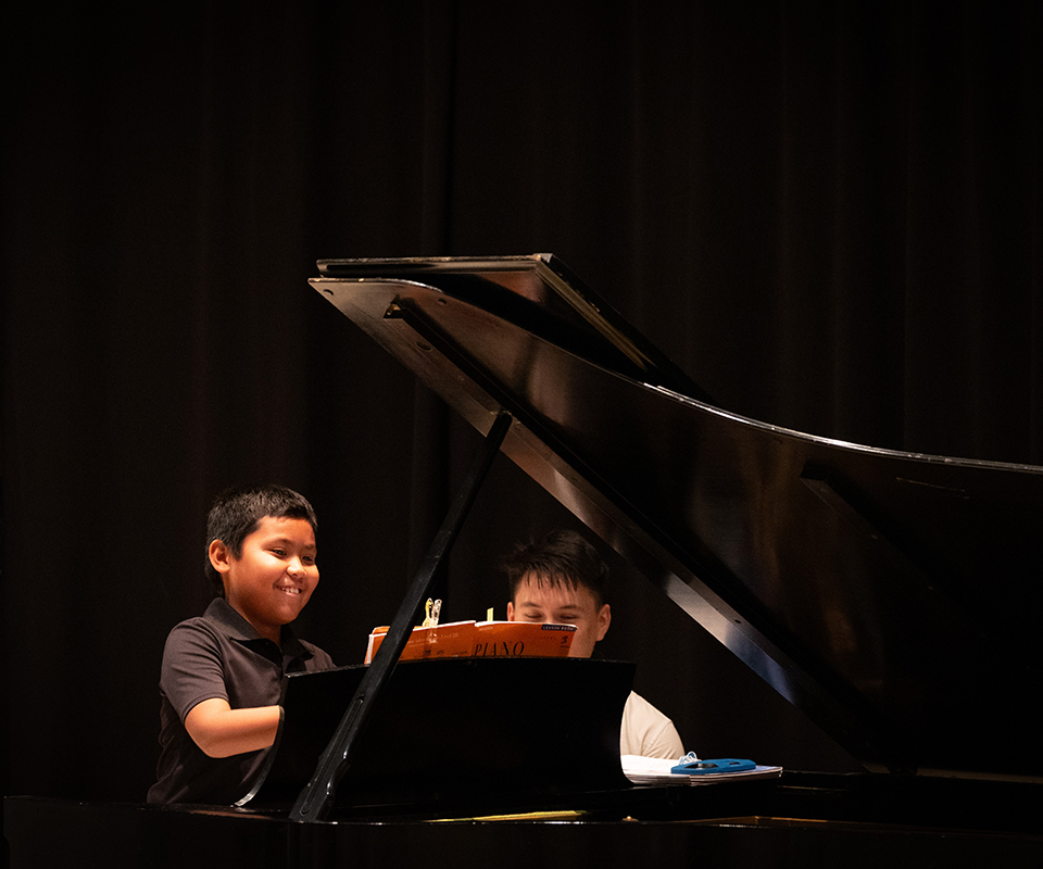 image of student from Ian's Music Studio playing piano.