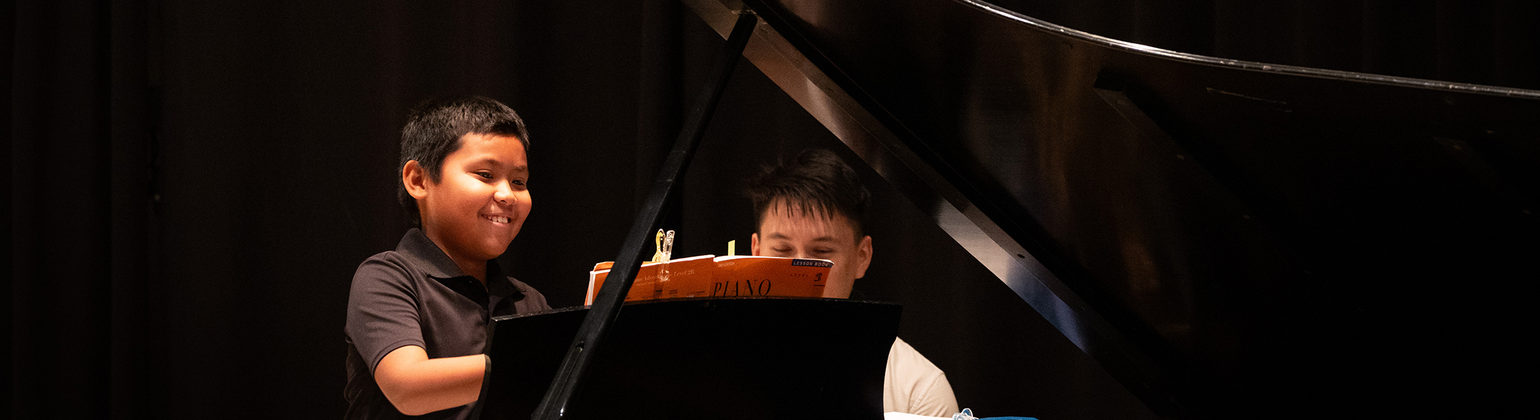 image of student from Ian's Music Studio playing piano.